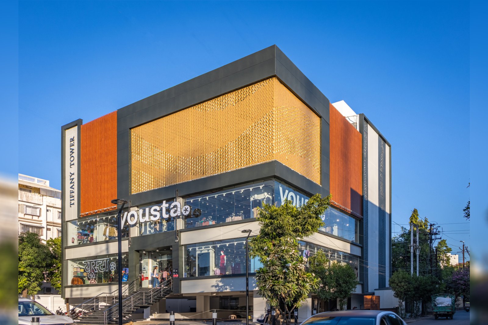 Modern office tower with dynamic gold metal cladding