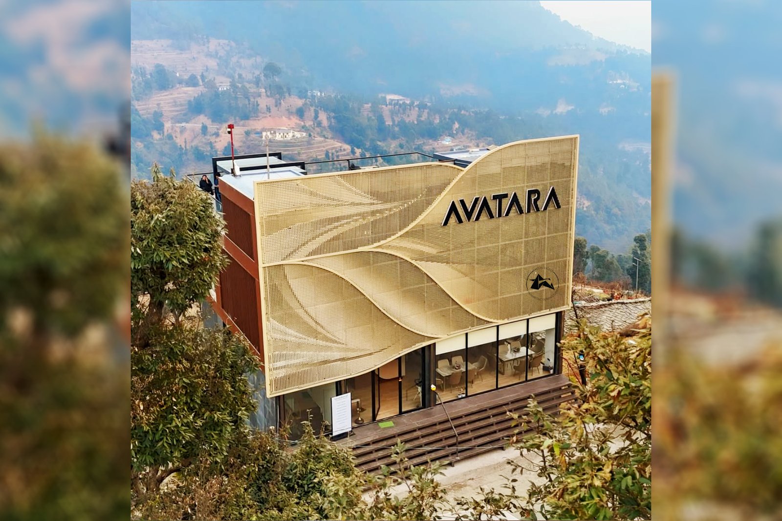 Reflective gold metal facade interacting with changing Himalayan light conditions on hotel exterior