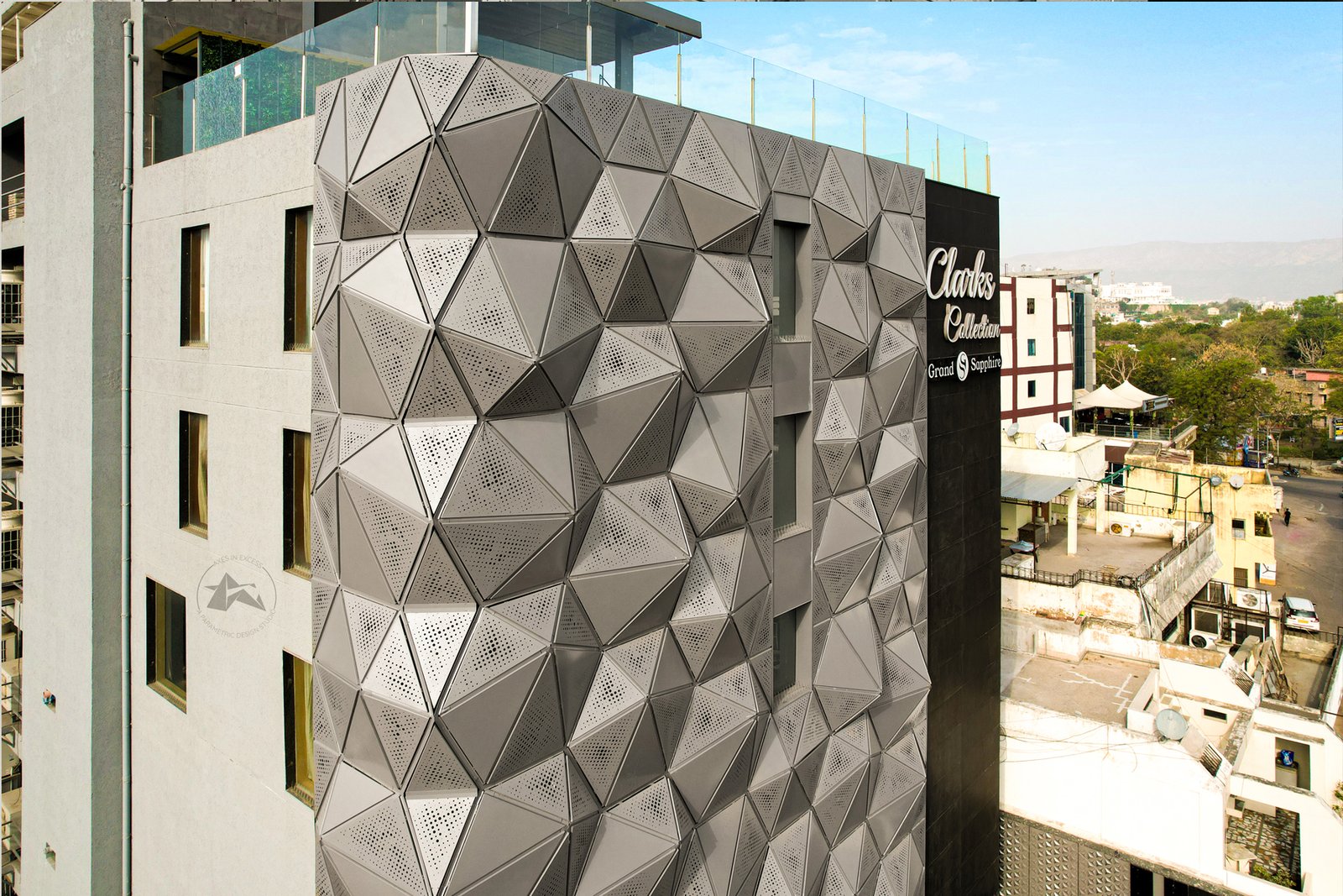 Contemporary hotel exterior with geometric aluminium facade by axes in excess