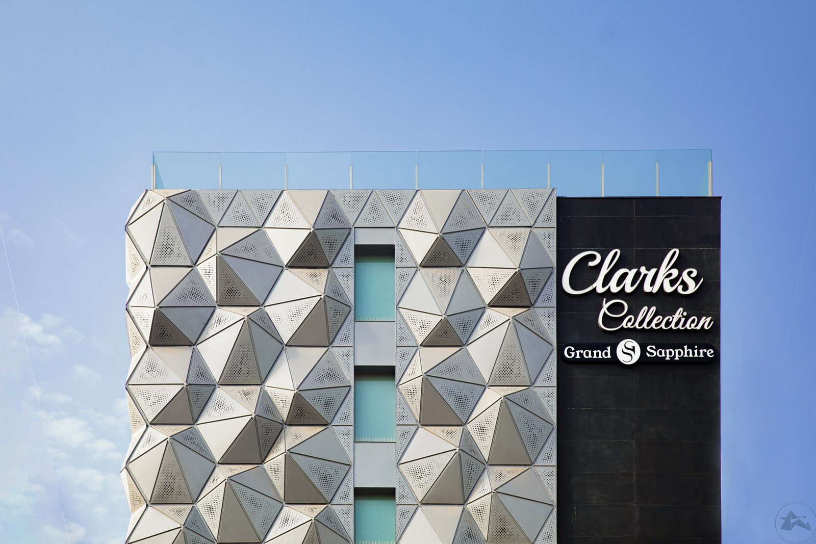 Perforated aluminium facade panels detail close-up by axes in excess