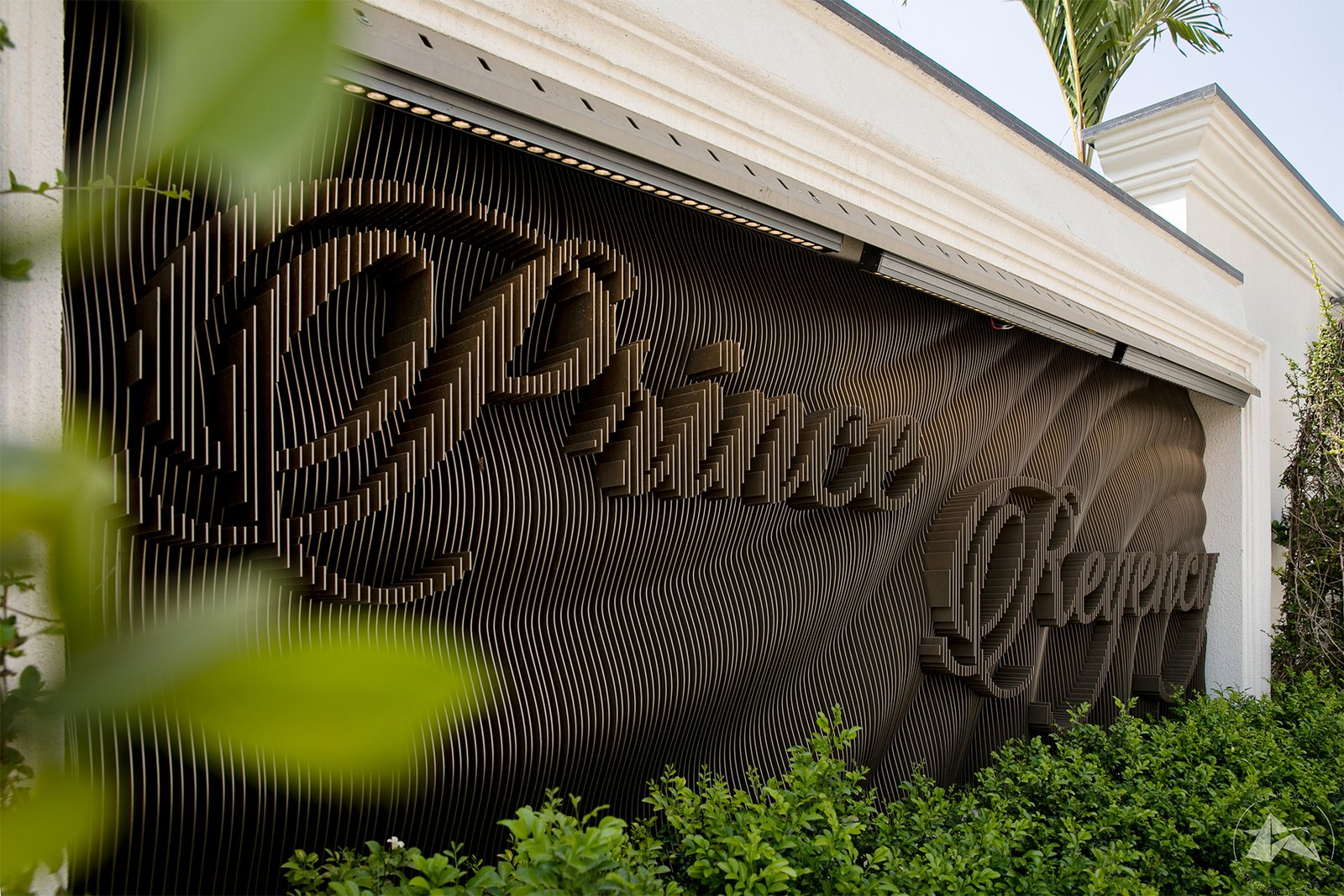 custom villa name plate with wave pattern by axes in excess