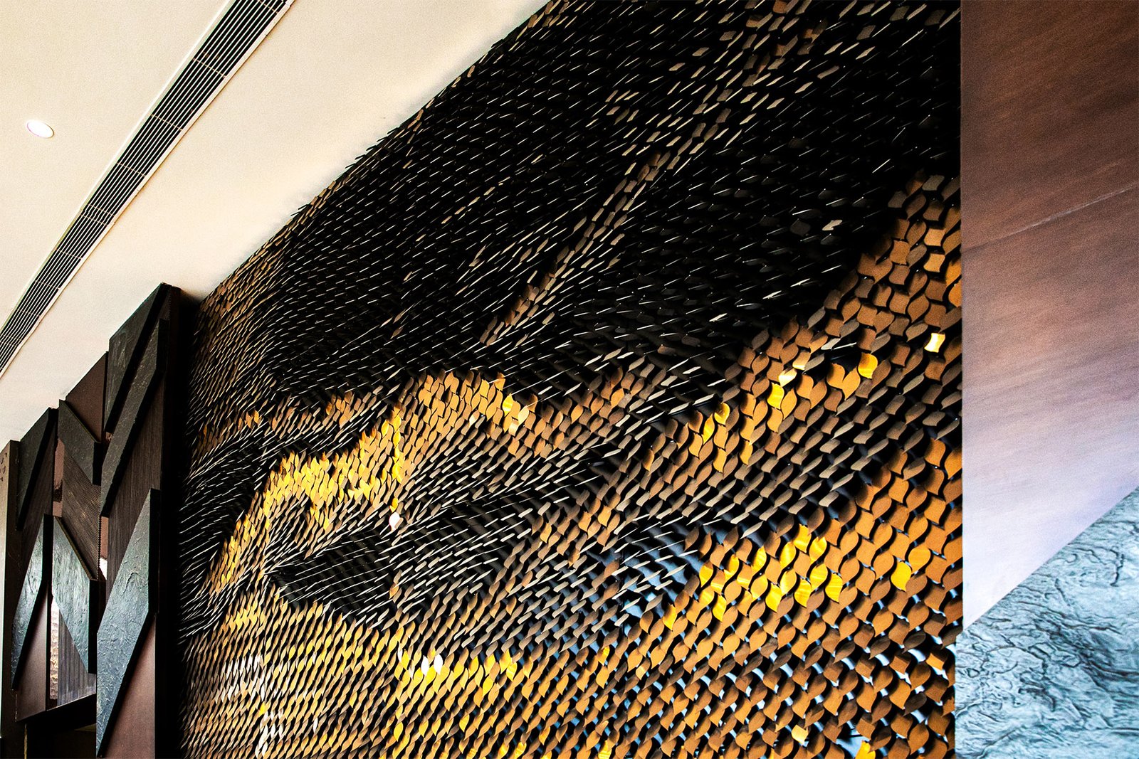 modern hotel reception feature wall metal by axes in excess