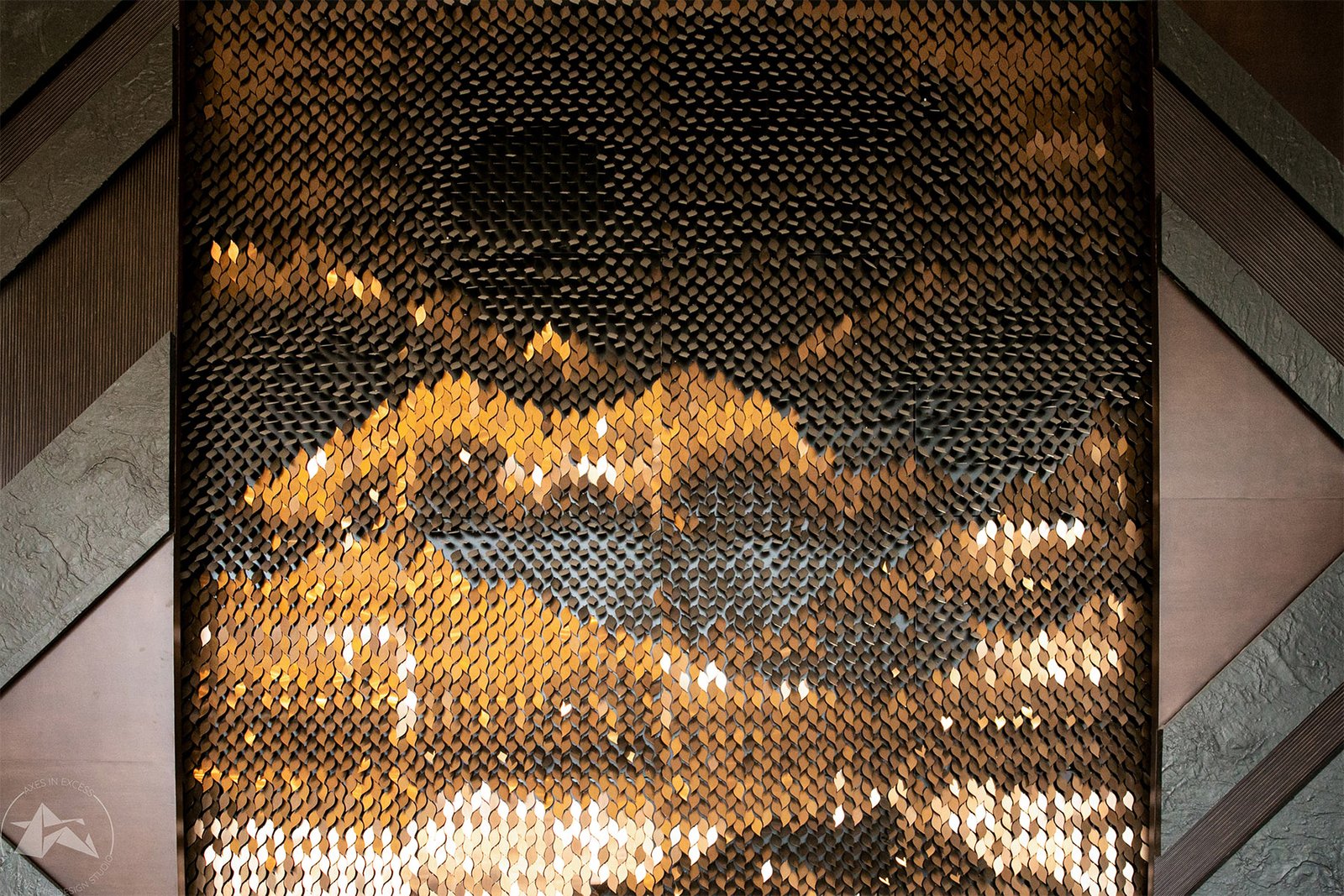 stainless steel leaf wall art installation by axes in excess