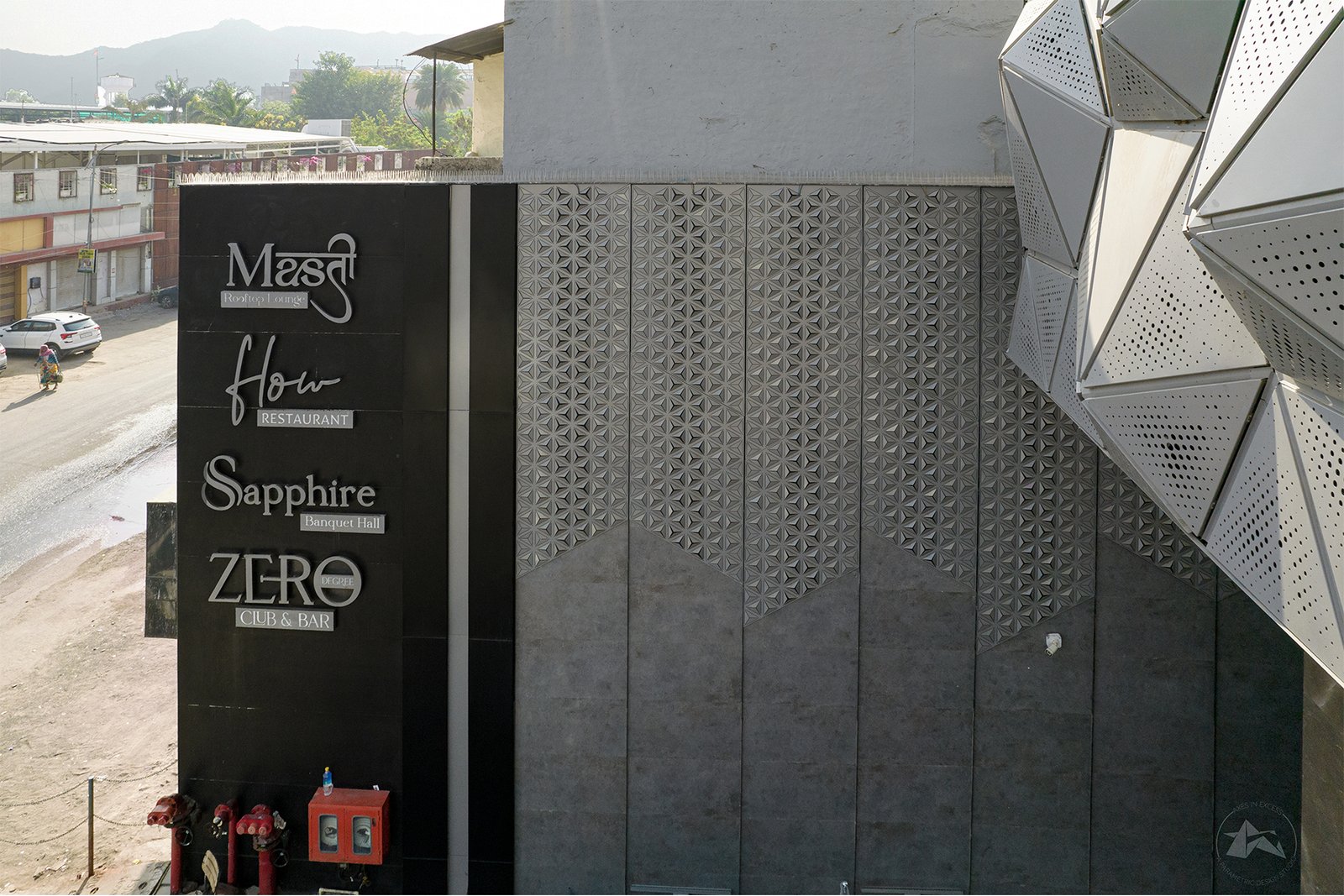 modern boundary wall design for hotel by axes in excess