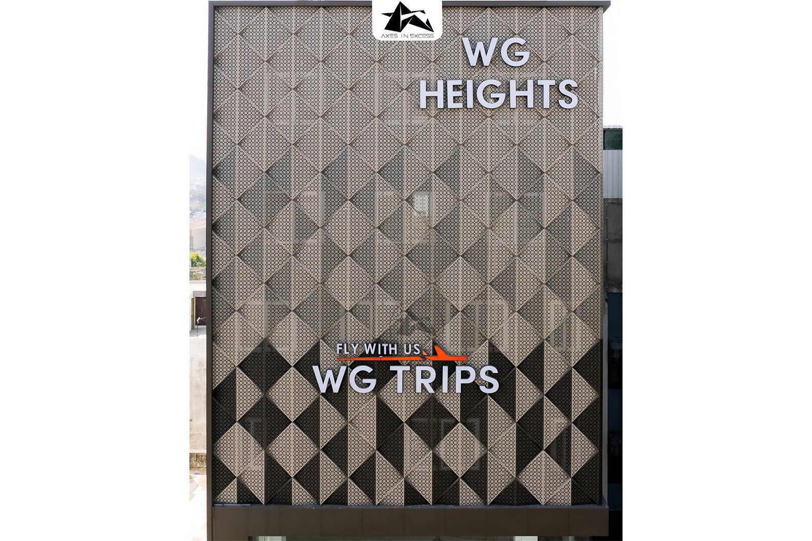 Multi color triangular facade cladding system by axes in excess