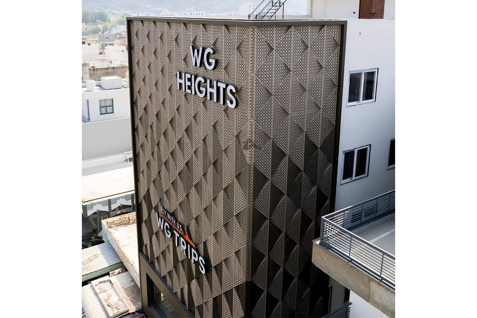 3D triangular metal box facade system India by axes in excess
