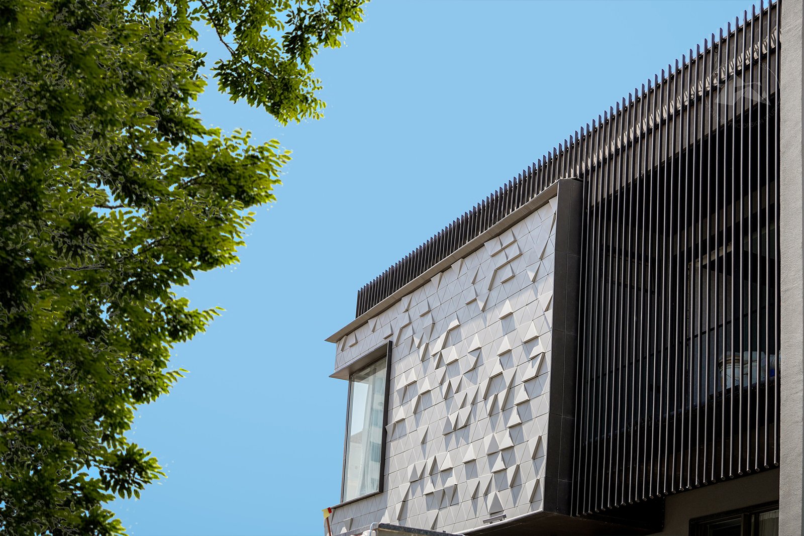 Modern architectural facade with 3D cladding panels