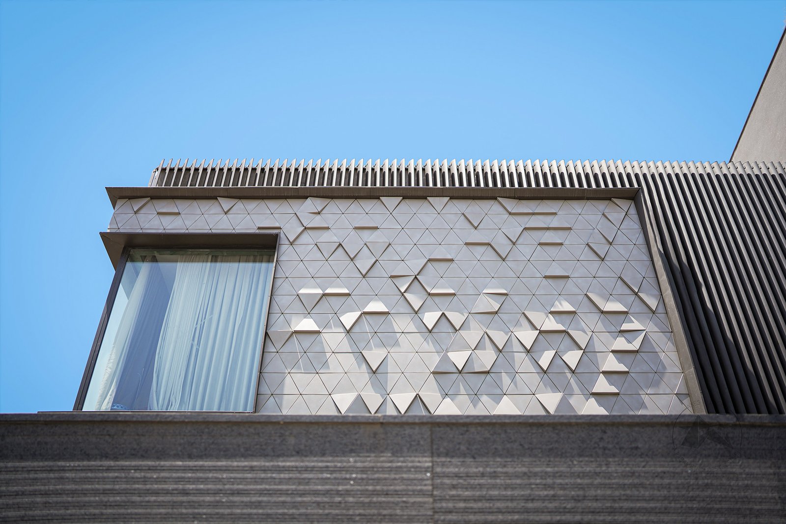 Modern house elevation with vertical aerofoil louvers
