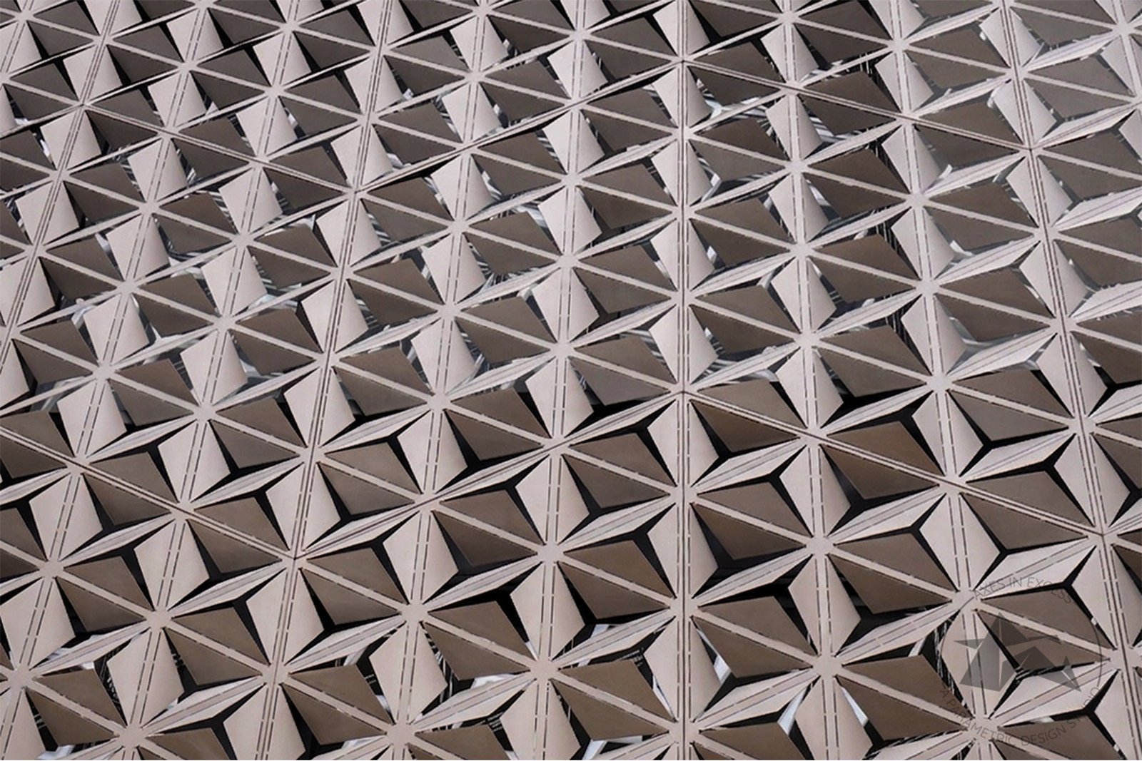 Architectural metal facade with Blossom Unveil system by Axes In Excess