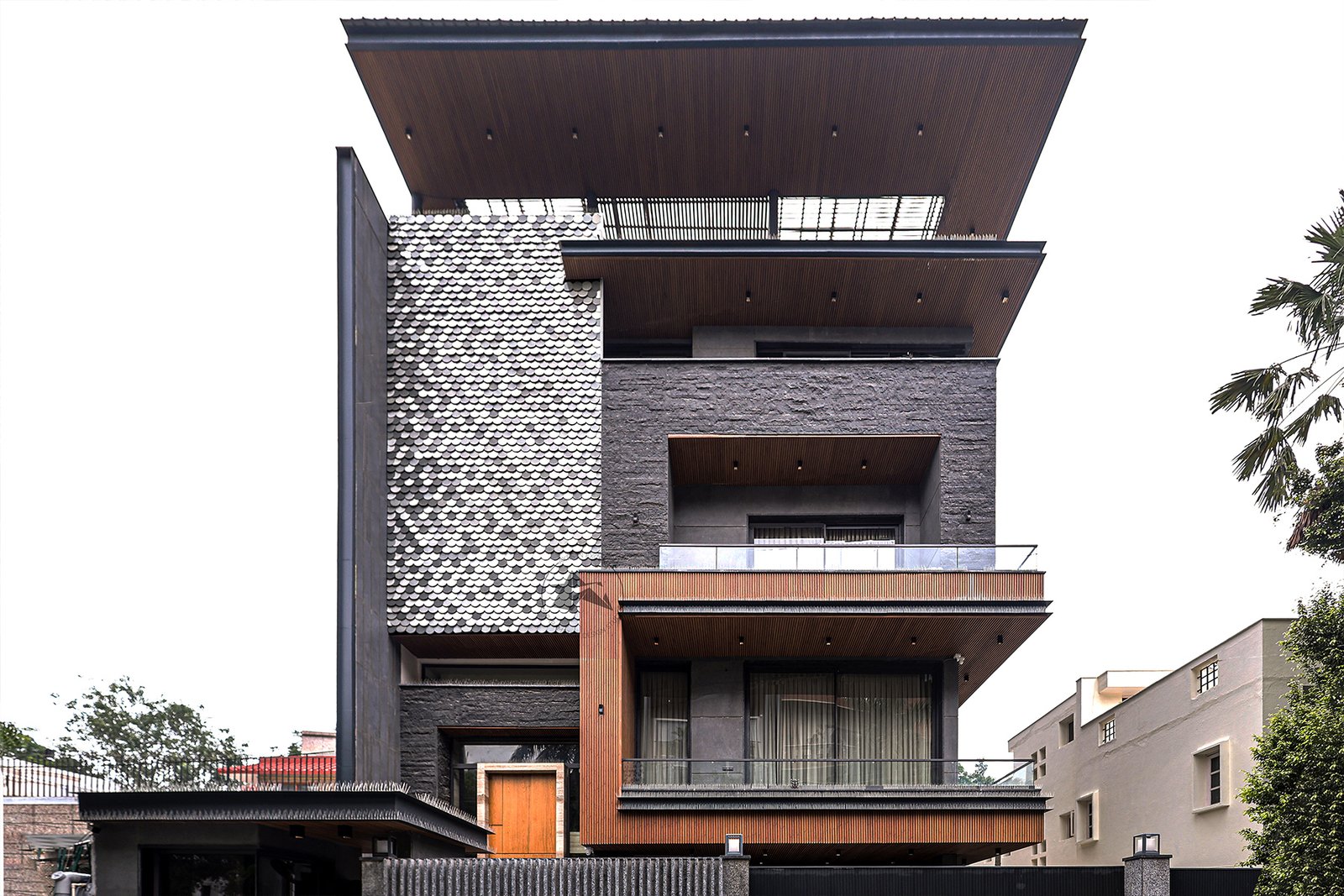 Multi-tone grey aluminium shingle facade for modern residence