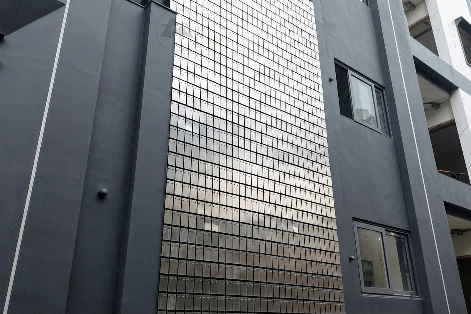 Rectangular kinetic screen on modern house facade